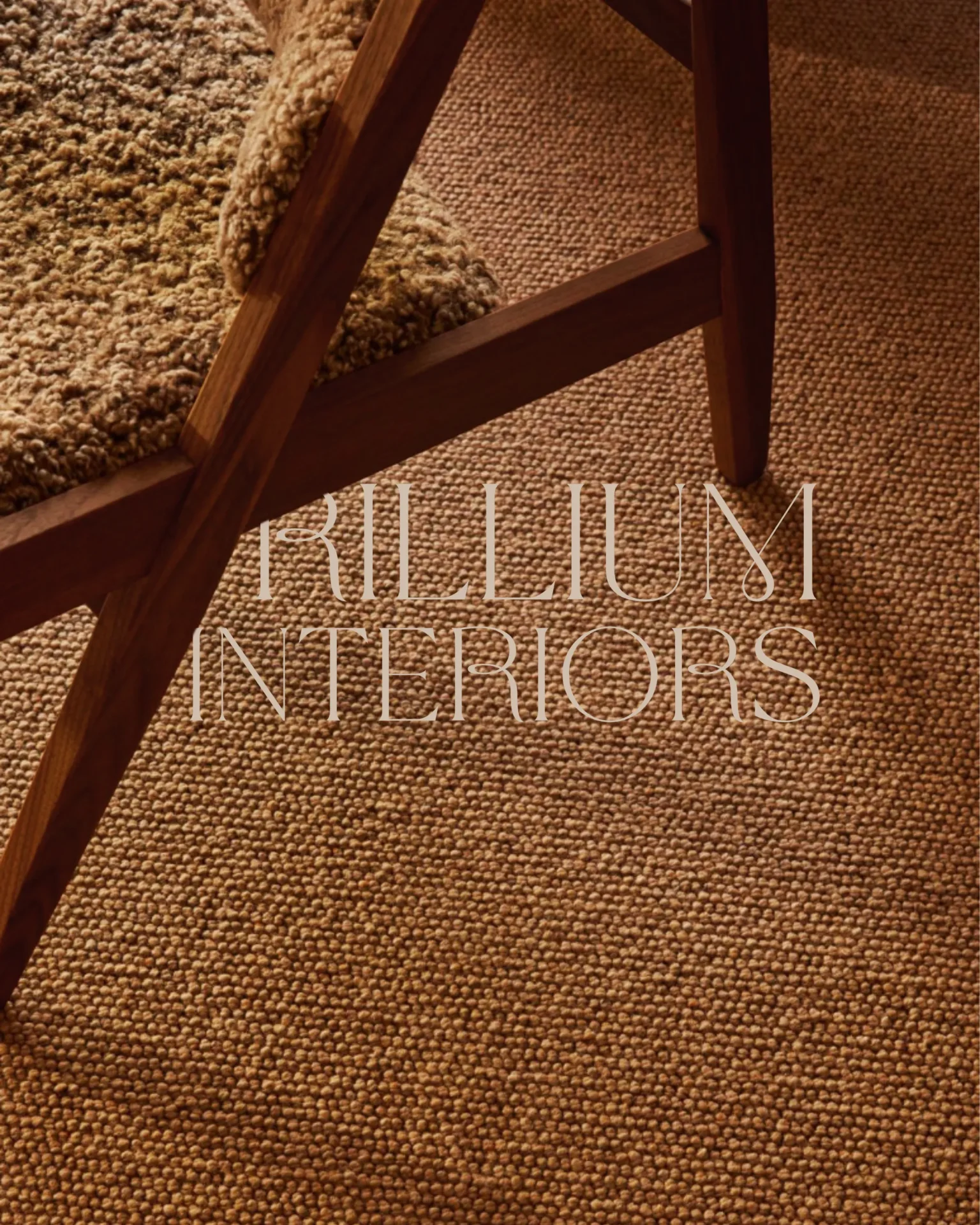 Close-up of a wooden chair leg resting on a textured beige carpet with large white text overlaid at the bottom (likely a magazine or product brand).