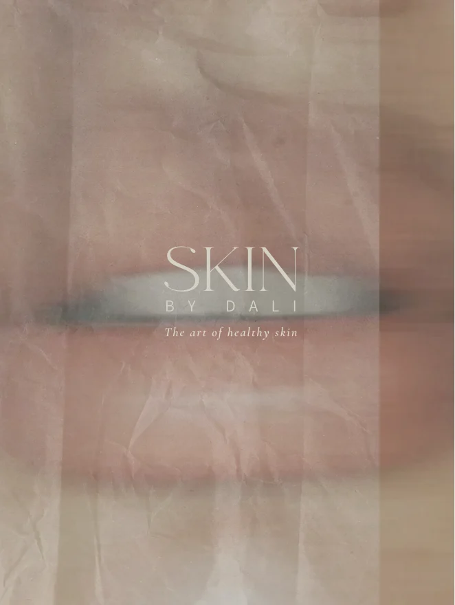 Packaging for SKIN by DALI skincare line with the tagline 'The art of healthy skin' on a soft pink background.
