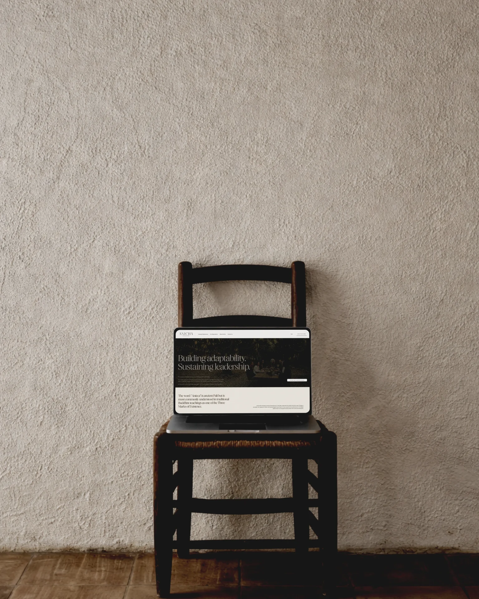 Laptop on a studio desk showing a clean Squarespace website layout, illustrating a design studio’s move from WordPress to Squarespace
